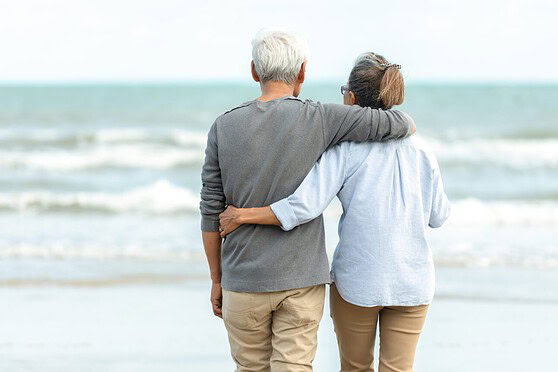 International Citizens Insurance, senior couple enjoying the beach together.