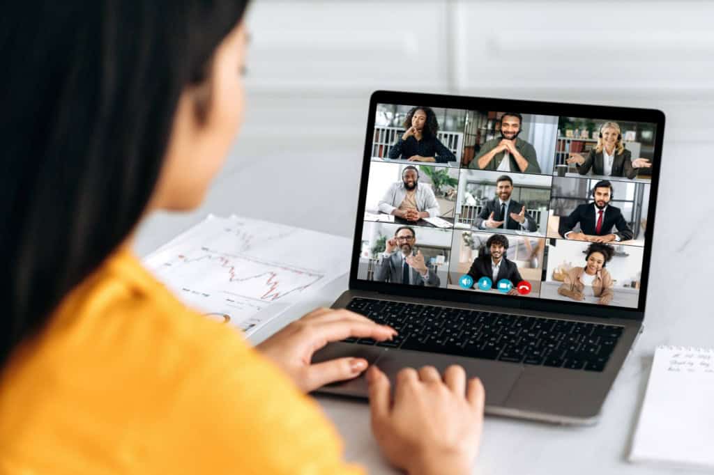 a marketing manager on a video call with her globally distributed team