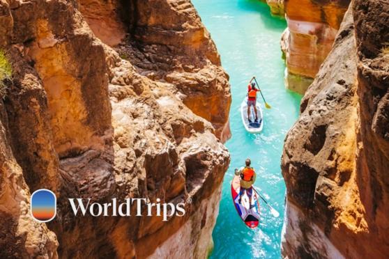 Two people paddleboarding in a narrow canyon with steep rock walls, Grand Canyon, Arizona.