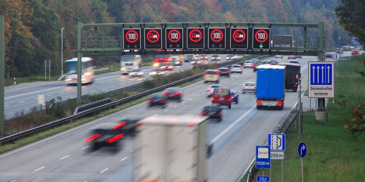 german-autobarn Traffic on german autobahn with speed limit signs, signalling the importance of having travel insurance for Germany