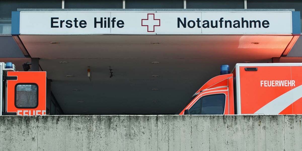 german-hospital emergency department with two ambulance cars in Berlin, signalling the importance of buying travel insurance for Germany before you visit