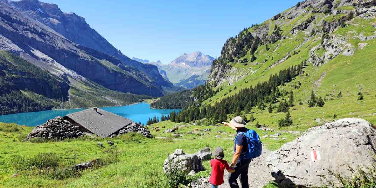 hiking-swiss-alps a father and son hiking in the Swiss Alps in Switzerland, one of the healthiest countries in the world