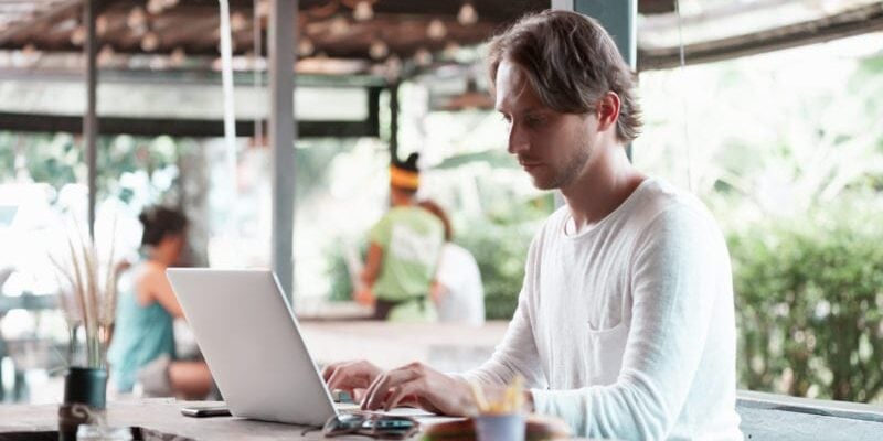 digital nomad working at a cafe