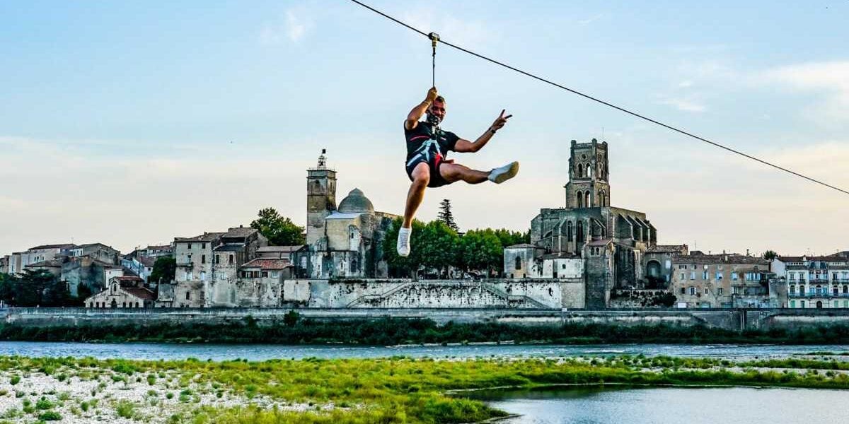 man-ziplining a man ziplining, highlighting the need for getting health insurance when becoming an expat